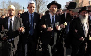 Jewish and Muslim leaders link arms in silent march to honour victims of shooting at Ozar Hatorah school in Toulouse